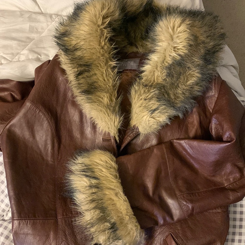 Brown leather coat.